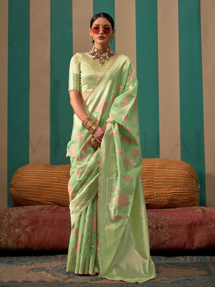 Mint Green and Peach linen saree with floral woven motifs and soft handloom texture This image captures the front drape view highlighting pallu fall and pleats alignment, ideal for visualizing festive elegance, designer appeal, and modern styling inspiration. Perfect for online shoppers seeking detailed previews before purchase, enhancing saree visual merchandising and SEO-rich product display strategy.                                                                                                          