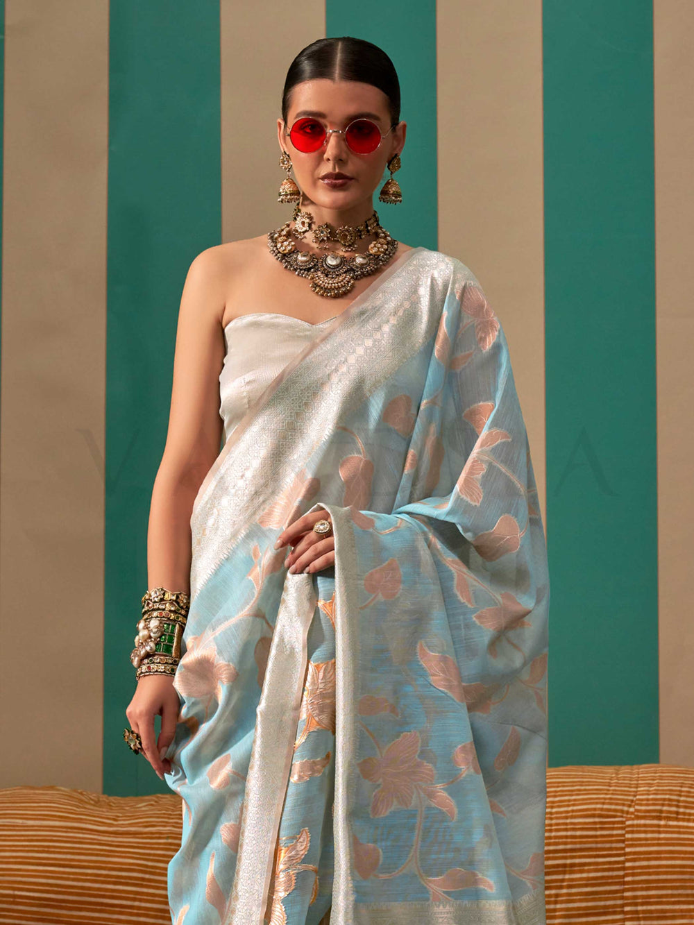 Sky Blue and Pearl White linen saree with floral woven motifs and soft handloom texture This image captures the side angle view showcasing blouse styling and zari border detail, ideal for visualizing festive elegance, designer appeal, and modern styling inspiration. Perfect for online shoppers seeking detailed previews before purchase, enhancing saree visual merchandising and SEO-rich product display strategy.                                                                                                   