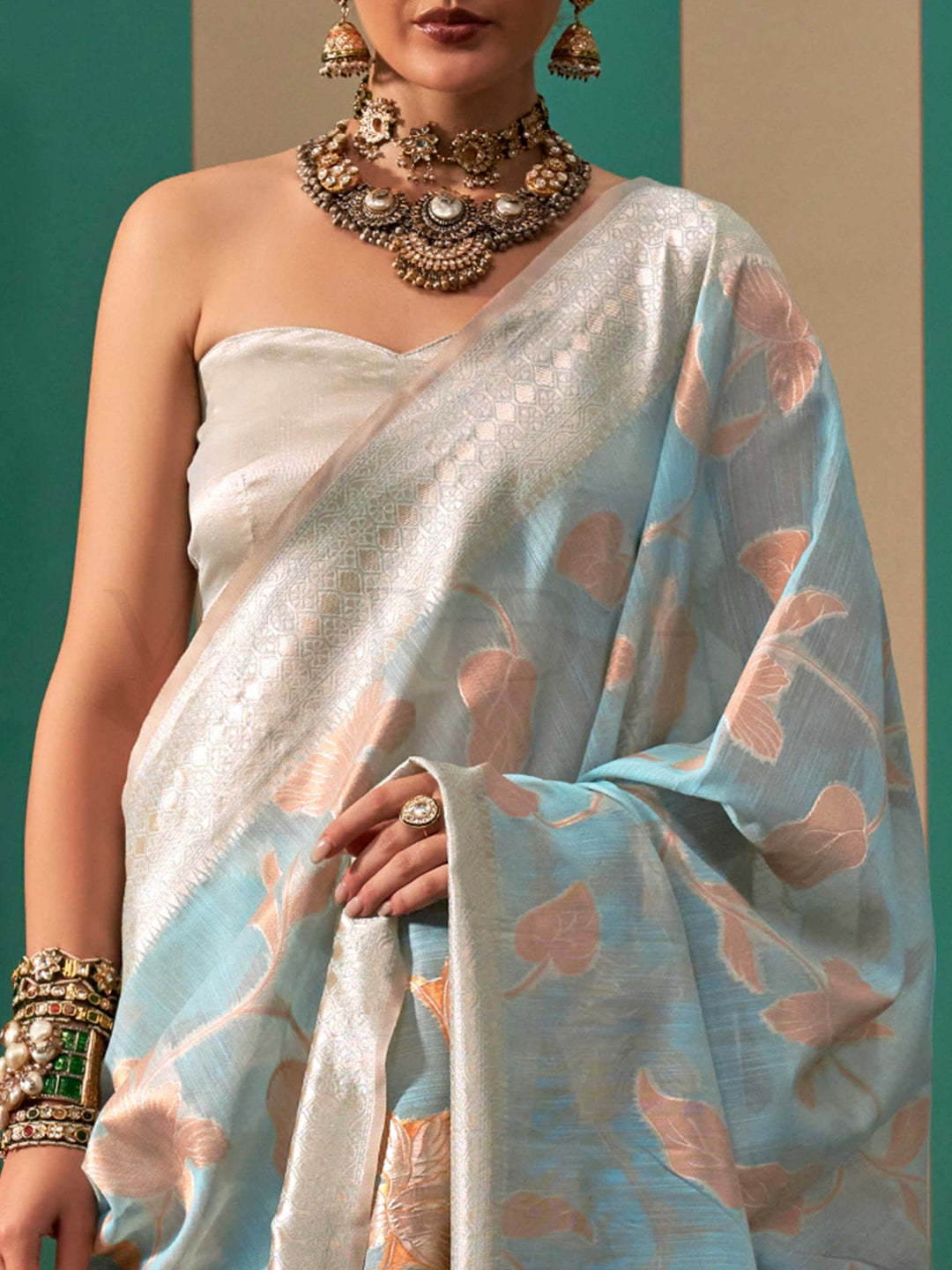 Sky Blue and Pearl White linen saree with floral woven motifs and soft handloom texture This image captures the zoomed texture view illustrating fabric weave and print clarity, ideal for visualizing festive elegance, designer appeal, and modern styling inspiration. Perfect for online shoppers seeking detailed previews before purchase, enhancing saree visual merchandising and SEO-rich product display strategy.                                                                                                    