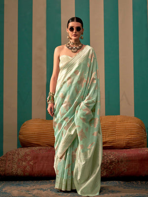 Aqua Green and Cream linen saree with floral woven motifs and soft handloom texture This image captures the front drape view highlighting pallu fall and pleats alignment, ideal for visualizing festive elegance, designer appeal, and modern styling inspiration. Perfect for online shoppers seeking detailed previews before purchase, enhancing saree visual merchandising and SEO-rich product display strategy.                                                                                                          