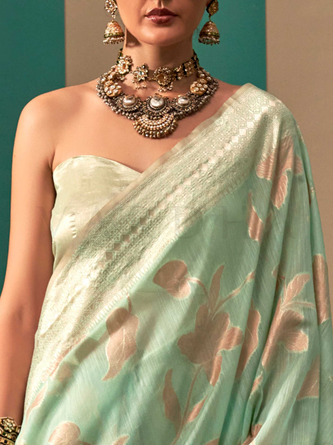Aqua Green and Cream linen saree with floral woven motifs and soft handloom texture This image captures the zoomed texture view illustrating fabric weave and print clarity, ideal for visualizing festive elegance, designer appeal, and modern styling inspiration. Perfect for online shoppers seeking detailed previews before purchase, enhancing saree visual merchandising and SEO-rich product display strategy.                                                                                                        