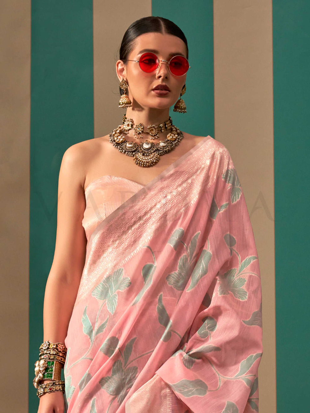 Baby Pink and Sky Blue linen saree with floral woven motifs and soft handloom texture This image captures the side angle view showcasing blouse styling and zari border detail, ideal for visualizing festive elegance, designer appeal, and modern styling inspiration. Perfect for online shoppers seeking detailed previews before purchase, enhancing saree visual merchandising and SEO-rich product display strategy.                                                                                                     