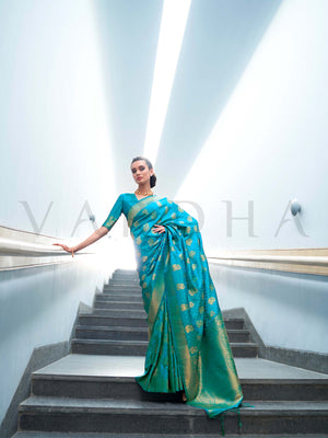 This Teal Green–Gold Satin Silk saree is crafted with intricate woven zari accents, ideal for receptions, festive wear, and ethnic elegance. A timeless drape with regal charm. SKU 179003. This Teal Green–Gold Satin Silk saree is crafted with intricate woven zari accents, ideal for receptions, festive wear, and ethnic elegance. A timeless drape with regal charm. SKU 179003.