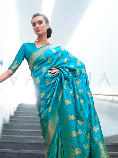 This Teal Green–Gold Satin Silk saree is crafted with intricate woven zari accents, ideal for receptions, festive wear, and ethnic elegance. A timeless drape with regal charm. SKU 179003. This Teal Green–Gold Satin Silk saree is crafted with intricate woven zari accents, ideal for receptions, festive wear, and ethnic elegance. A timeless drape with regal charm. SKU 179003.