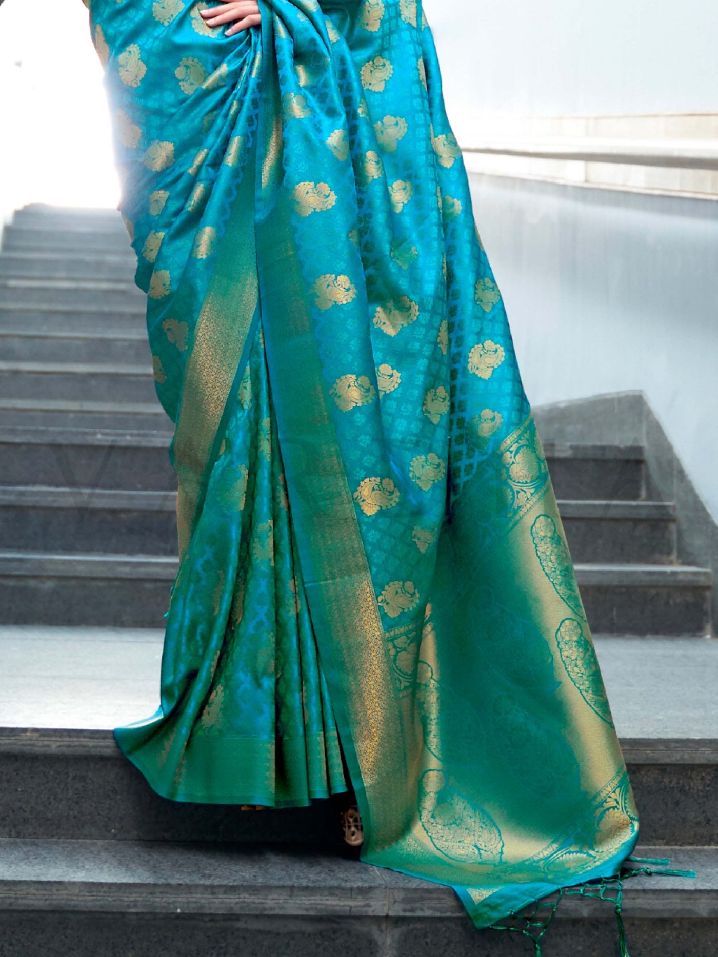 This Teal Green–Gold Satin Silk saree is crafted with intricate woven zari accents, ideal for receptions, festive wear, and ethnic elegance. A timeless drape with regal charm. SKU 179003. This Teal Green–Gold Satin Silk saree is crafted with intricate woven zari accents, ideal for receptions, festive wear, and ethnic elegance. A timeless drape with regal charm. SKU 179003.