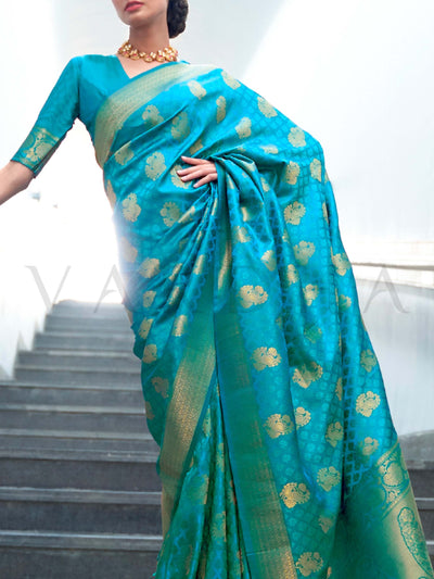 This Teal Green–Gold Satin Silk saree is crafted with intricate woven zari accents, ideal for receptions, festive wear, and ethnic elegance. A timeless drape with regal charm. SKU 179003. This Teal Green–Gold Satin Silk saree is crafted with intricate woven zari accents, ideal for receptions, festive wear, and ethnic elegance. A timeless drape with regal charm. SKU 179003.