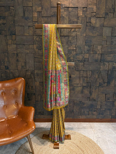 Colorful patterned fabric draped over a wooden stand against a textured wall.