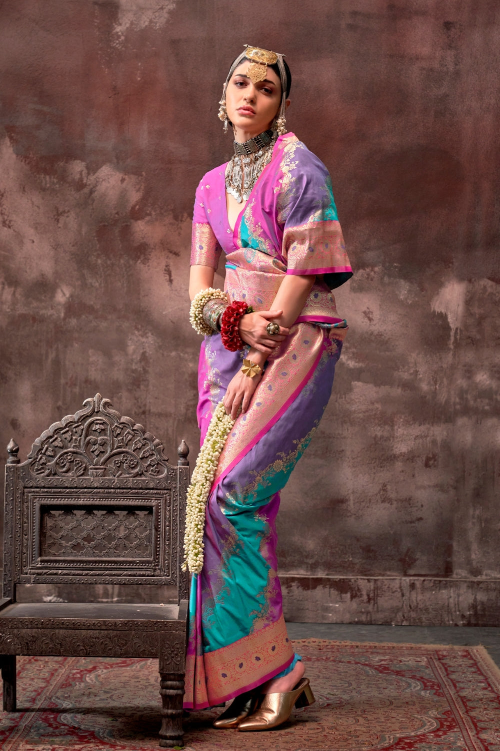 Purple and Aqua Blue Rangkaat silk saree with temple borders, intricate zari pallu, and traditional wedding styling. Handloom drape perfect for wedding functions and south indian muhurtham, styled with mogra, antique jewelry, and regal stance. This image captures the zoomed texture view illustrating fabric weave and print clarity, ideal for visualizing festive elegance, designer appeal, and modern styling inspiration. Perfect for online shoppers seeking detailed previews before purchase, enhancing saree vis