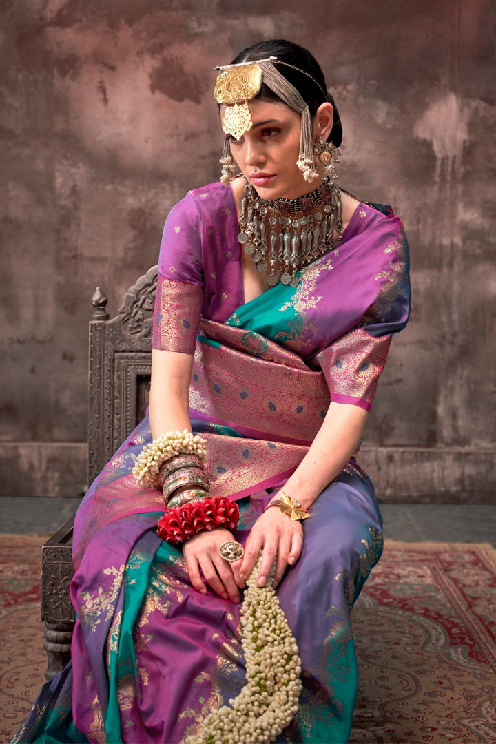 Purple and Aqua Blue Rangkaat silk saree with temple borders, intricate zari pallu, and traditional wedding styling. Handloom drape perfect for wedding functions and south indian muhurtham, styled with mogra, antique jewelry, and regal stance. This image captures the model styling perspective with complete saree ensemble displayed, ideal for visualizing festive elegance, designer appeal, and modern styling inspiration. Perfect for online shoppers seeking detailed previews before purchase, enhancing saree vi