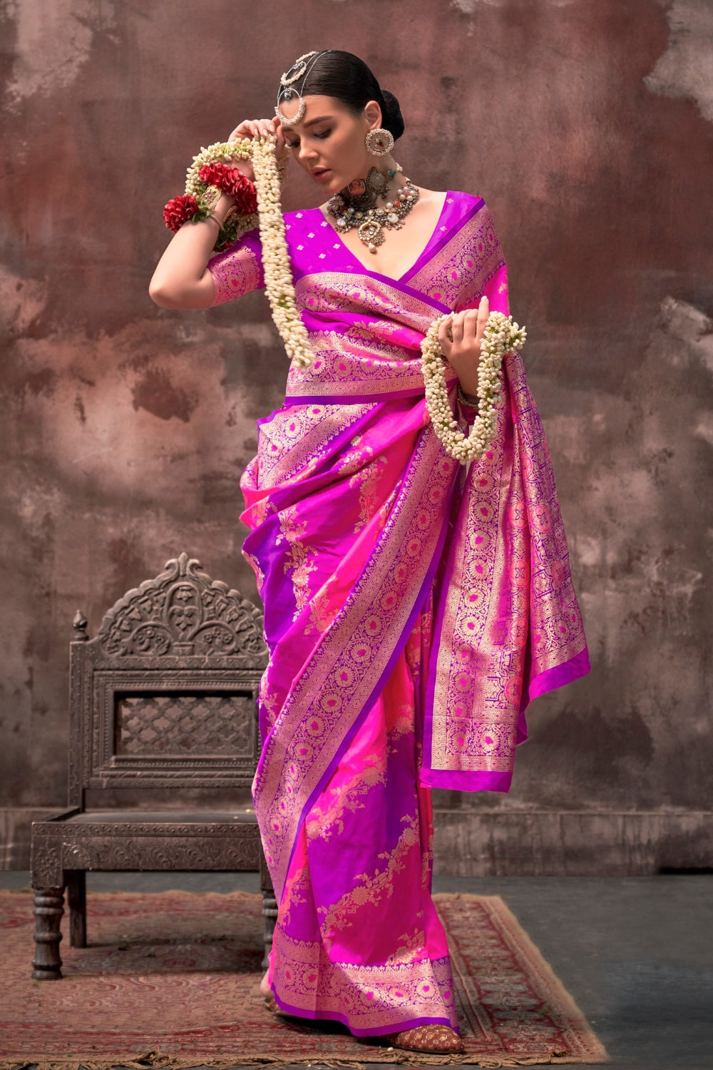 Rani Pink and Magenta Rangkaat silk saree with temple borders, intricate zari pallu, and traditional wedding styling. Handloom drape perfect for sangeet functions and bridal sangeet, styled with mogra, antique jewelry, and regal stance. This image captures the front drape view highlighting pallu fall and pleats alignment, ideal for visualizing festive elegance, designer appeal, and modern styling inspiration. Perfect for online shoppers seeking detailed previews before purchase, enhancing saree visual merch
