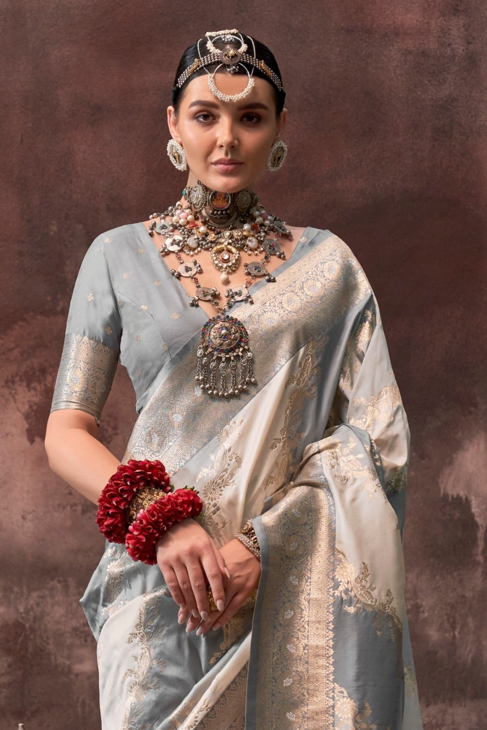 Pearl Grey and Ivory Rangkaat silk saree with temple borders, intricate zari pallu, and traditional wedding styling. Handloom drape perfect for party-wear functions and reception or gala, styled with mogra, antique jewelry, and regal stance. This image captures the back drape focus revealing pallu finesse and motif richness, ideal for visualizing festive elegance, designer appeal, and modern styling inspiration. Perfect for online shoppers seeking detailed previews before purchase, enhancing saree visual me