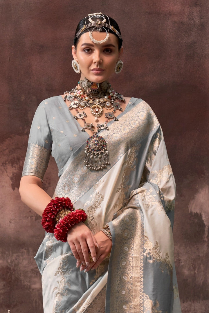 Pearl Grey and Ivory Rangkaat silk saree with temple borders, intricate zari pallu, and traditional wedding styling. Handloom drape perfect for party-wear functions and reception or gala, styled with mogra, antique jewelry, and regal stance. This image captures the back drape focus revealing pallu finesse and motif richness, ideal for visualizing festive elegance, designer appeal, and modern styling inspiration. Perfect for online shoppers seeking detailed previews before purchase, enhancing saree visual me