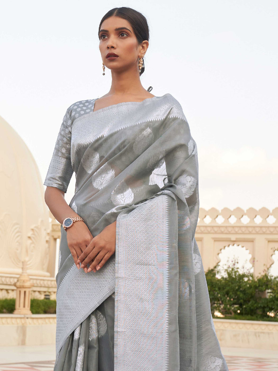 This Ash Grey–Silver Linen saree features refined woven floral motifs, perfect for haldi mornings, pooja rituals, and cultural celebrations. Crafted for breathable elegance and timeless grace. SKU 216003. This Ash Grey–Silver Linen saree features refined woven floral motifs, perfect for haldi mornings, pooja rituals, and cultural celebrations. Crafted for breathable elegance and timeless grace. SKU 216003.