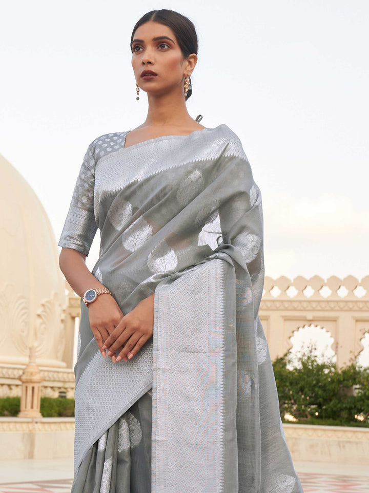 This Ash Grey–Silver Linen saree features refined woven floral motifs, perfect for haldi mornings, pooja rituals, and cultural celebrations. Crafted for breathable elegance and timeless grace. SKU 216003. This Ash Grey–Silver Linen saree features refined woven floral motifs, perfect for haldi mornings, pooja rituals, and cultural celebrations. Crafted for breathable elegance and timeless grace. SKU 216003.