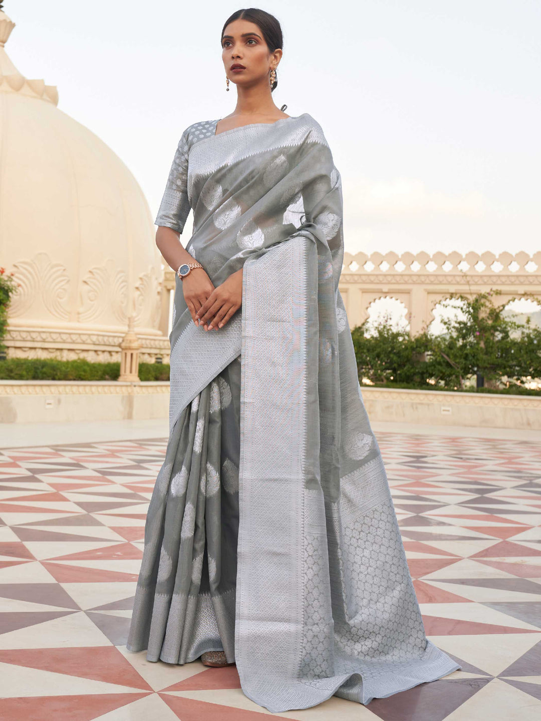 This Ash Grey–Silver Linen saree features refined woven floral motifs, perfect for haldi mornings, pooja rituals, and cultural celebrations. Crafted for breathable elegance and timeless grace. SKU 216003. This Ash Grey–Silver Linen saree features refined woven floral motifs, perfect for haldi mornings, pooja rituals, and cultural celebrations. Crafted for breathable elegance and timeless grace. SKU 216003.