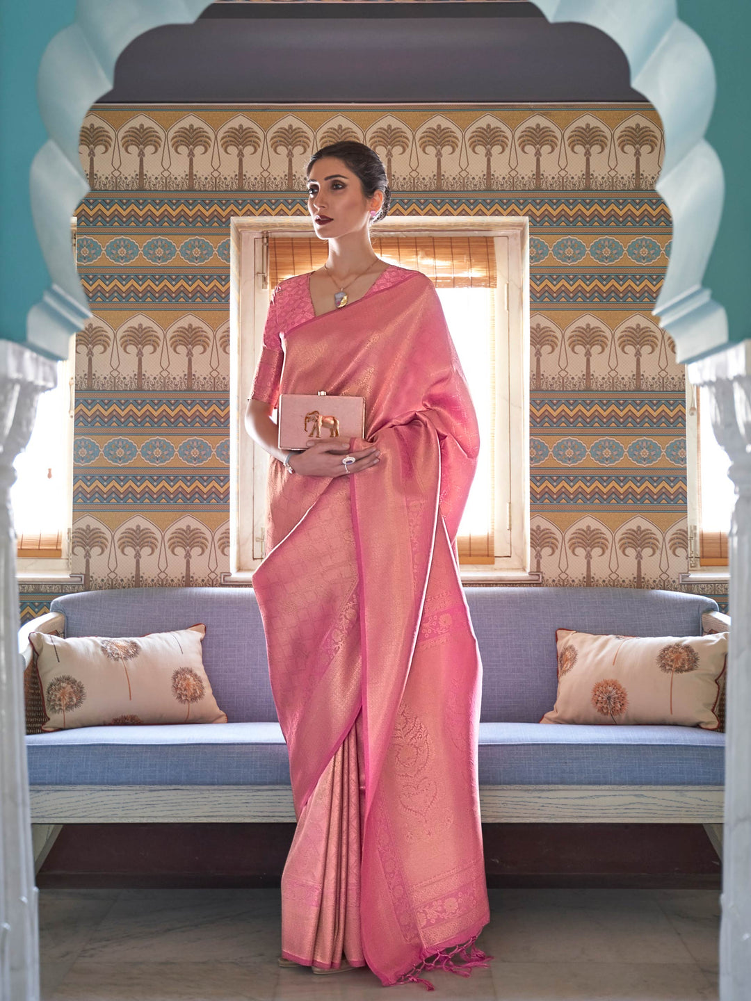 Rose Pink Kanjivaram Silk Saree with Gold Zari featuring traditional woven motifs and elegant wedding-ready drape. Traditional silk saree in rose pink with golden zari floral detailing, perfect for bridal and festive occasions.