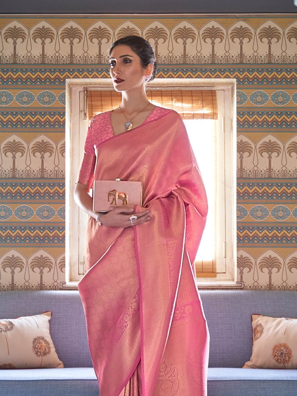 Elegant rose pink woven kanjivaram saree with golden pallu motifs and soft luxurious finish. Wedding-ready Kanjivaram saree in rose pink silk with zari embellishments for a regal ethnic look.