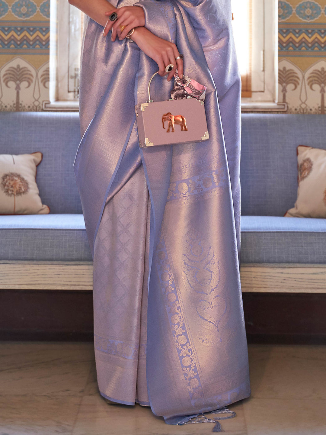 Wedding function ready kanjivaram saree in Lilac–Silver with sheen texture. Lustrous silk saree in Lilac–Silver shade with intricate zari detailing and contrast styling.