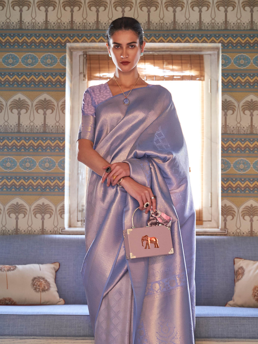 Soft Lilac–Silver drape with traditional zari border, jacquard weave and blouse piece. Classic Indian festive silk saree in Lilac–Silver with woven motifs for poojas and haldi.