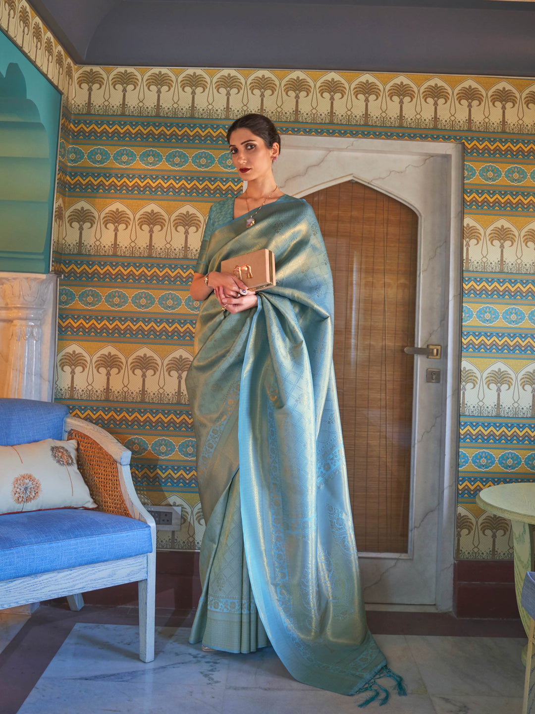 Aqua Blue–Gold silk saree with woven zari motifs and kanjivaram texture, ideal for weddings. Elegant Aqua Blue–Gold kanjivaram silk saree featuring gold/silver threadwork and festive pallu.