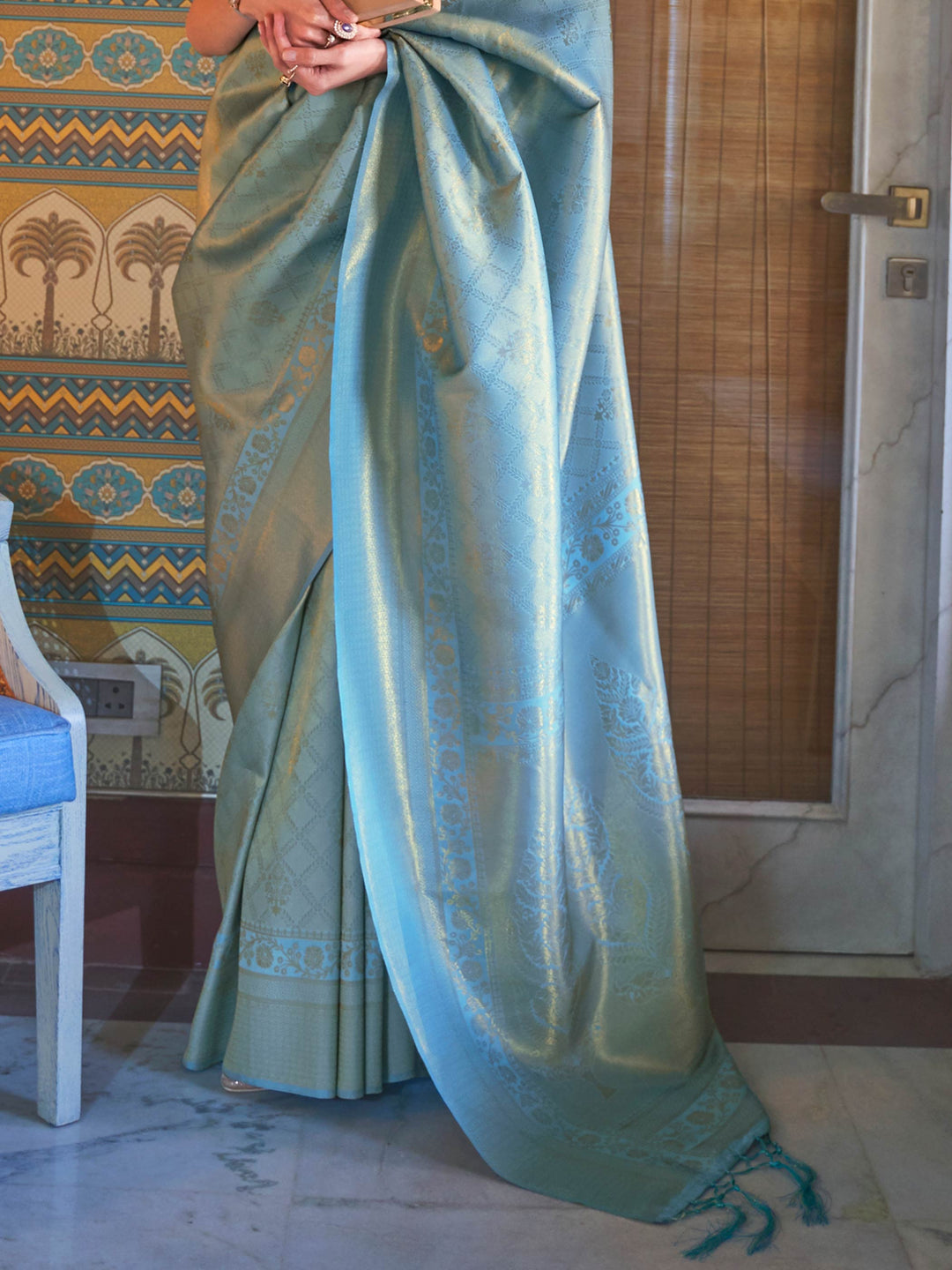 Wedding function ready kanjivaram saree in Aqua Blue–Gold with sheen texture. Lustrous silk saree in Aqua Blue–Gold shade with intricate zari detailing and contrast styling.
