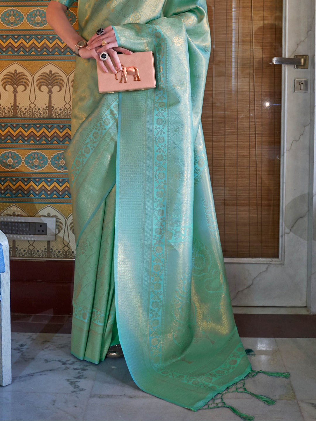 Wedding function ready kanjivaram saree in Mint Green–Gold with sheen texture. Lustrous silk saree in Mint Green–Gold shade with intricate zari detailing and contrast styling.