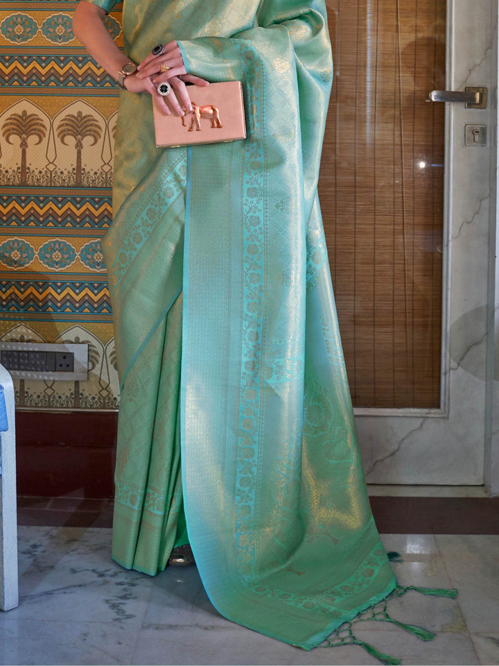 Wedding function ready kanjivaram saree in Mint Green–Gold with sheen texture. Lustrous silk saree in Mint Green–Gold shade with intricate zari detailing and contrast styling.