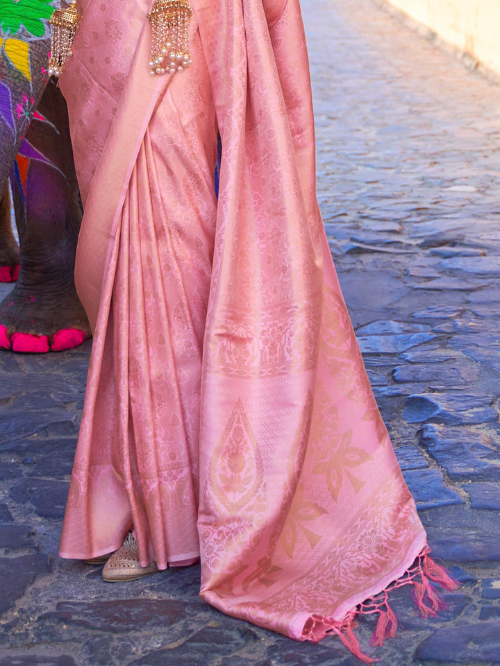 Sophisticated ethnic saree in kanjivaram silk featuring luxurious gold zari work. Classic rose pink kanjivaram saree with border detailing for ethnic fashion moments.