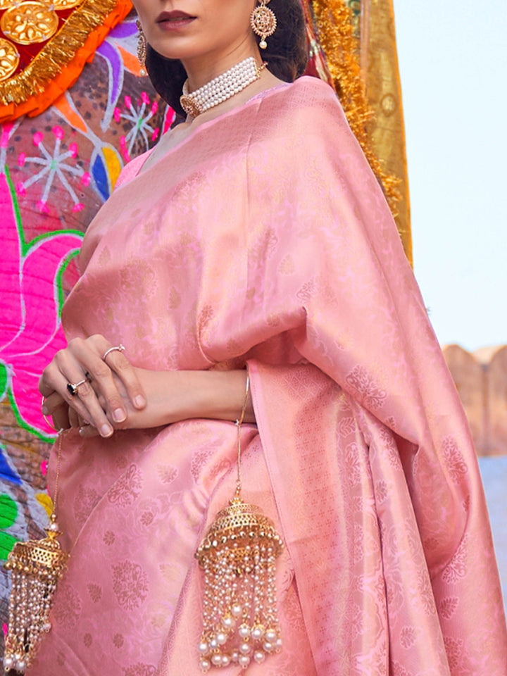 Traditional saree styled for festivals, woven in rose pink silk and gold accents. Ethnic fashion meets luxury in this rose pink woven silk saree with golden pallu flair.