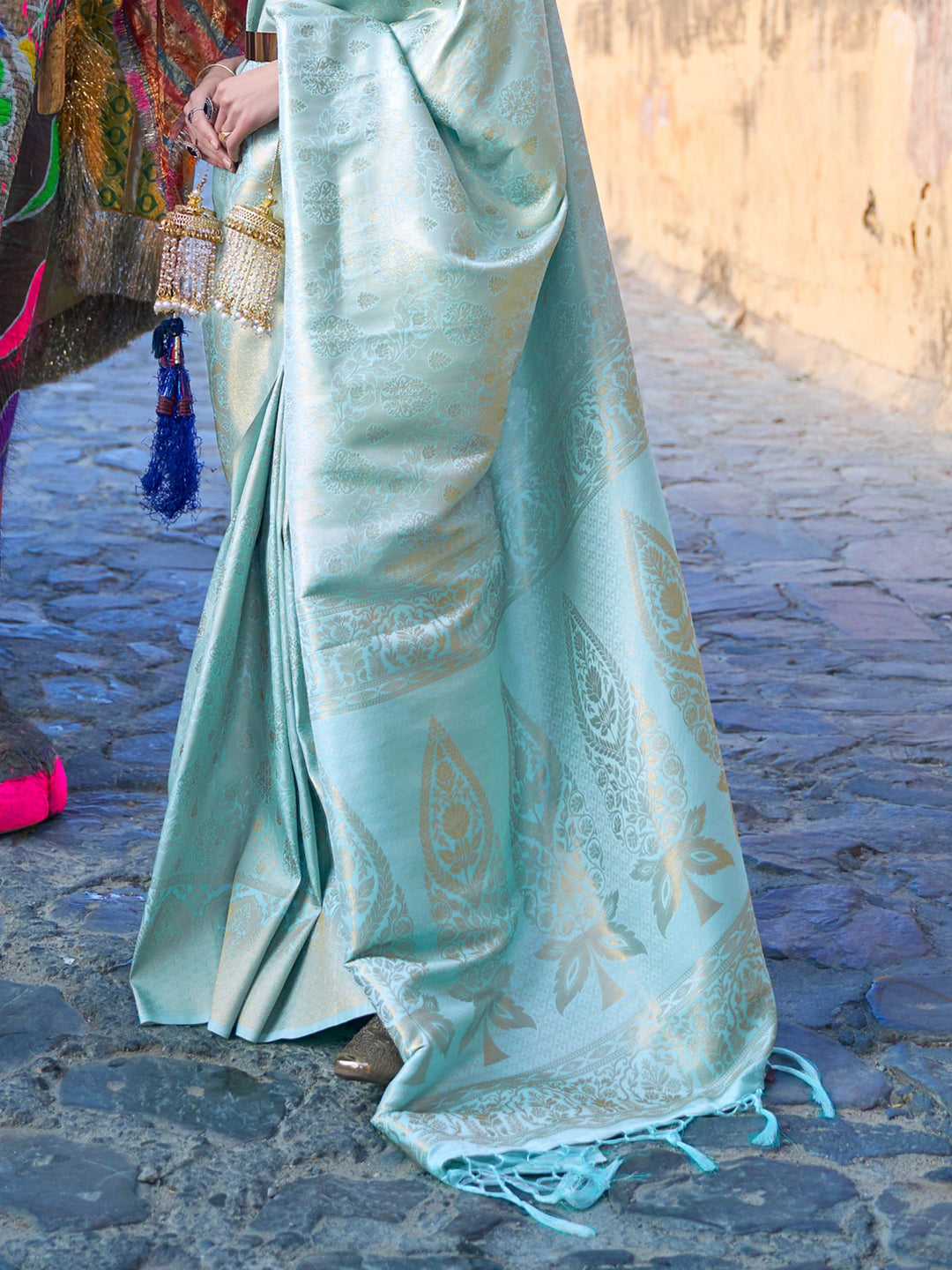 Traditional silk weave with gold accents across Mint Blue–Gold body and pallu. Elegant Mint Blue–Gold saree in kanjivaram silk for poojas and family celebrations.