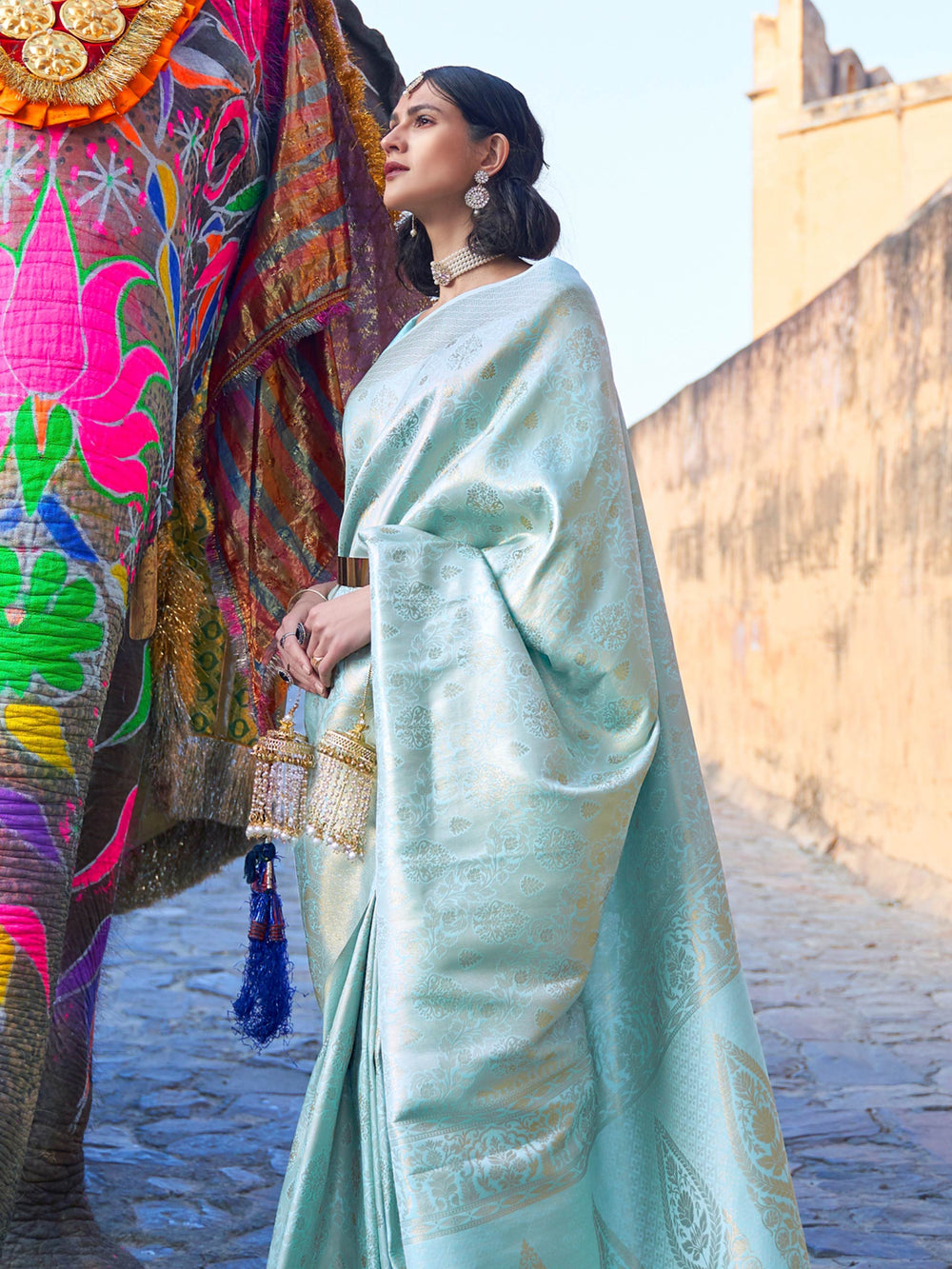 Graceful Mint Blue–Gold ethnic saree with soft kanjivaram texture for traditional events. Zari detailed silk saree in Mint Blue–Gold, styled for day weddings and sangeet functions.