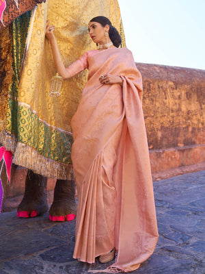 Peach–Gold kanjivaram silk saree featuring gold zari motifs and elegant drape for festive occasions. Classic Peach–Gold silk saree with woven zari borders and festive pallu.