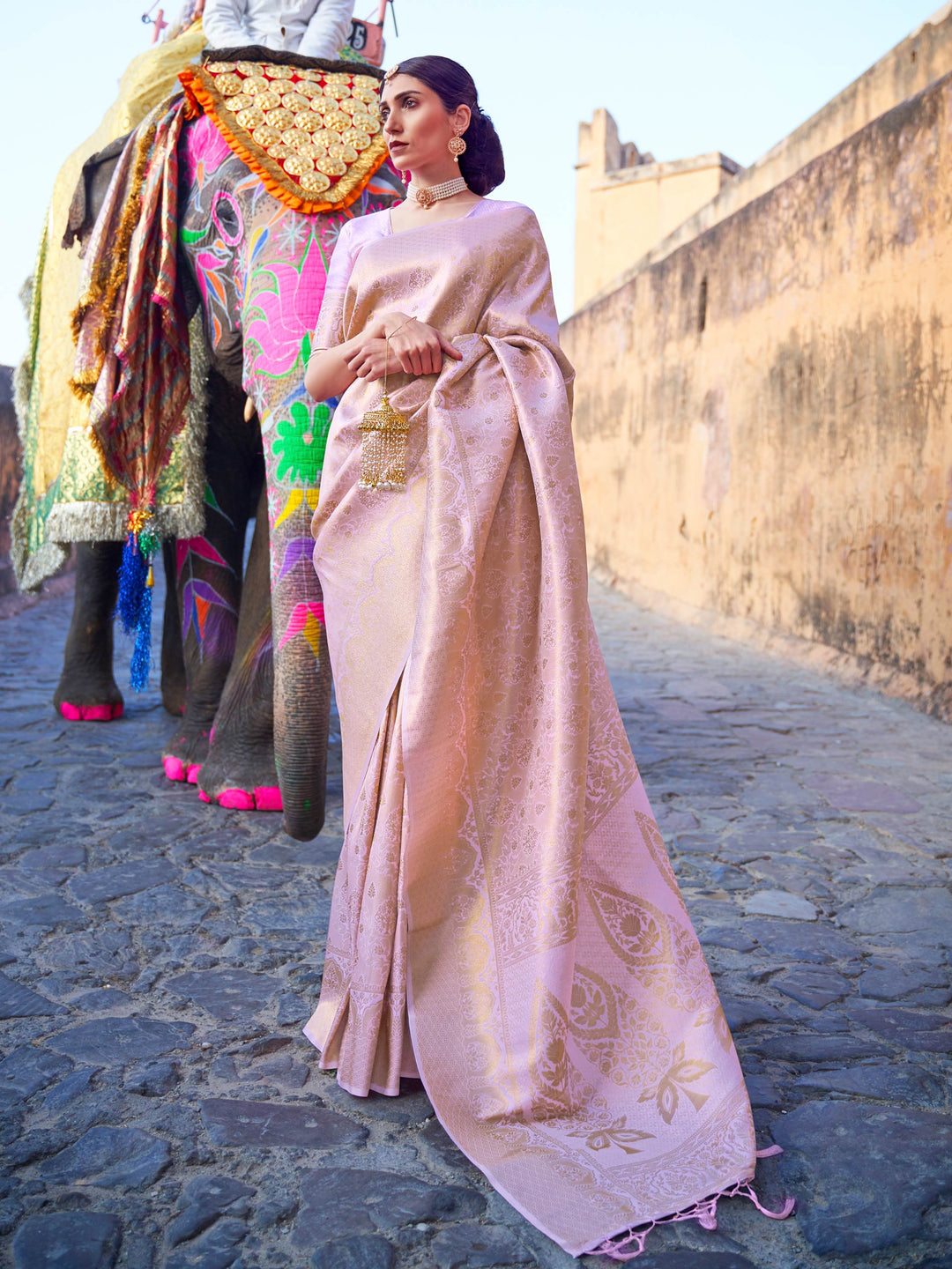 Beige–Gold kanjivaram silk saree featuring gold zari motifs and elegant drape for festive occasions. Classic Beige–Gold silk saree with woven zari borders and festive pallu.
