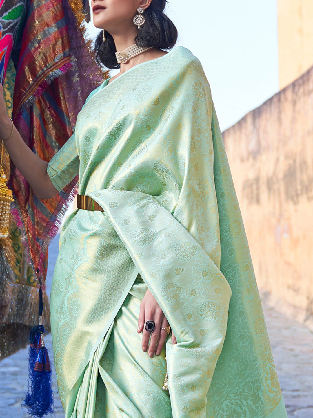 Sea Green–Gold woven saree with luxurious detailing, perfect for wedding occasions. Festive kanjivaram drape in Sea Green–Gold silk, styled with zari pallu and ethnic borders.