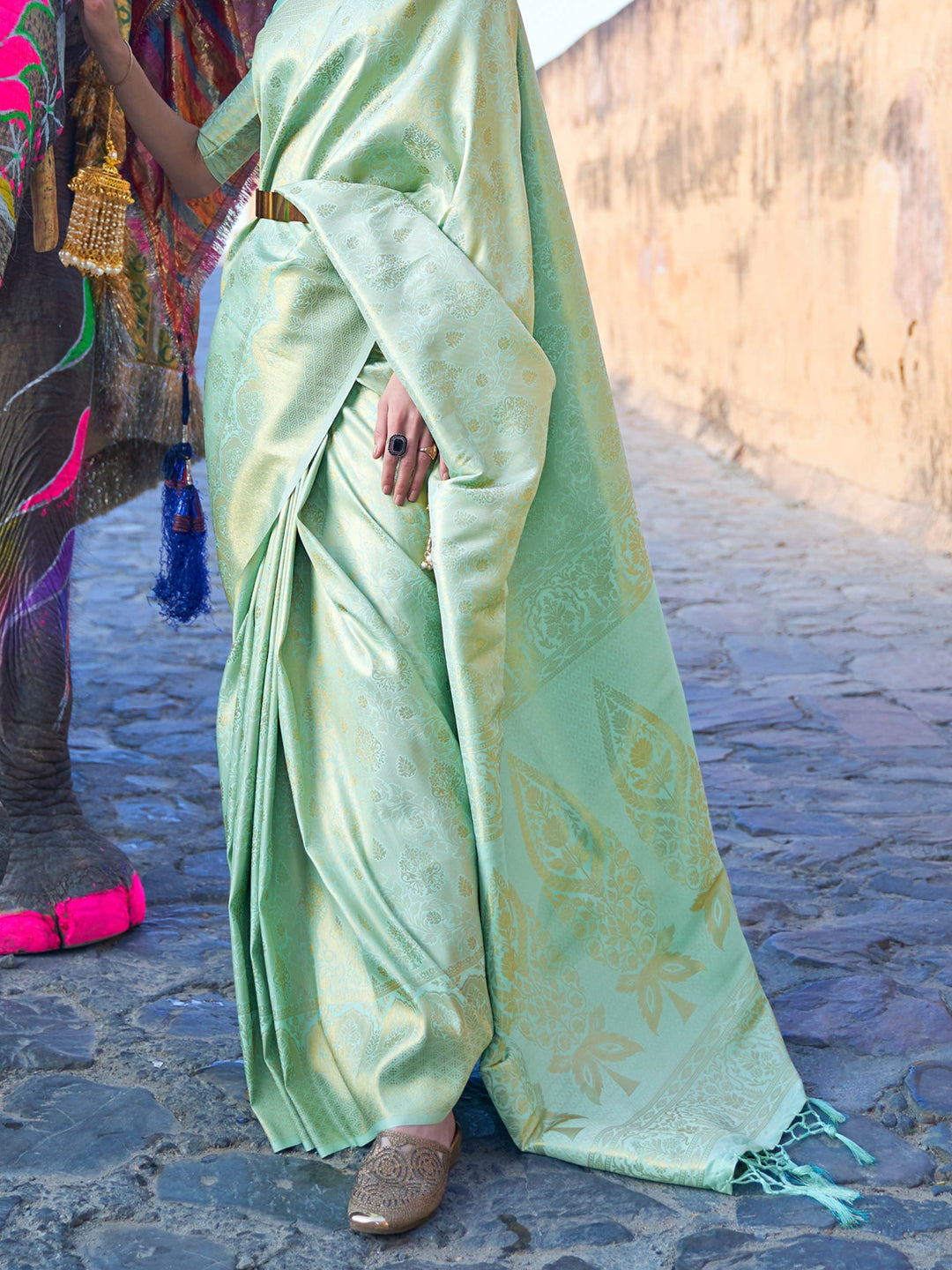 Traditional silk weave with gold accents across Sea Green–Gold body and pallu. Elegant Sea Green–Gold saree in kanjivaram silk for poojas and family celebrations.