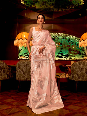This Blush Pink–Silver Organza saree features subtle silver woven detailing for a dreamy, feather-light silhouette ideal for receptions, photoshoots, and elegant gatherings. Designed for lightness, movement, and soft glamour. SKU 255001. This Blush Pink–Silver Organza saree features subtle silver woven detailing for a dreamy, feather-light silhouette ideal for receptions, photoshoots, and elegant gatherings. Designed for lightness, movement, and soft glamour. SKU 255001.
