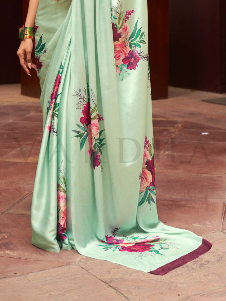 This Mint Green–Fuchsia Satin Crepe saree showcases stunning digital floral print that enhances its party-ready drape. Digitally crafted floral elegance for day-to-night ethnic wear. SKU 260005. This Mint Green–Fuchsia Satin Crepe saree showcases stunning digital floral print that enhances its party-ready drape. Digitally crafted floral elegance for day-to-night ethnic wear. SKU 260005.