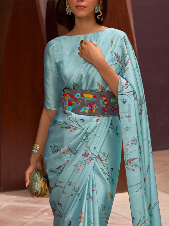 This Ice Blue–Multi Satin Crepe saree showcases stunning digital floral print that enhances its party-ready drape. Digitally crafted floral elegance for day-to-night ethnic wear. SKU 260006. This Ice Blue–Multi Satin Crepe saree showcases stunning digital floral print that enhances its party-ready drape. Digitally crafted floral elegance for day-to-night ethnic wear. SKU 260006.