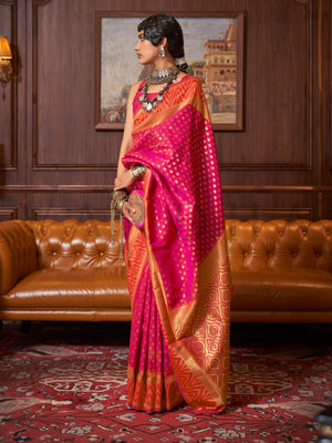 This luxurious Rani Pink–Gold Kanjivaram Silk saree features classic woven zari work with contrast pallu and ornate detailing. Elegant wedding attire with heritage style and timeless drape. SKU 271002. This luxurious Rani Pink–Gold Kanjivaram Silk saree features classic woven zari work with contrast pallu and ornate detailing. Elegant wedding attire with heritage style and timeless drape. SKU 271002.