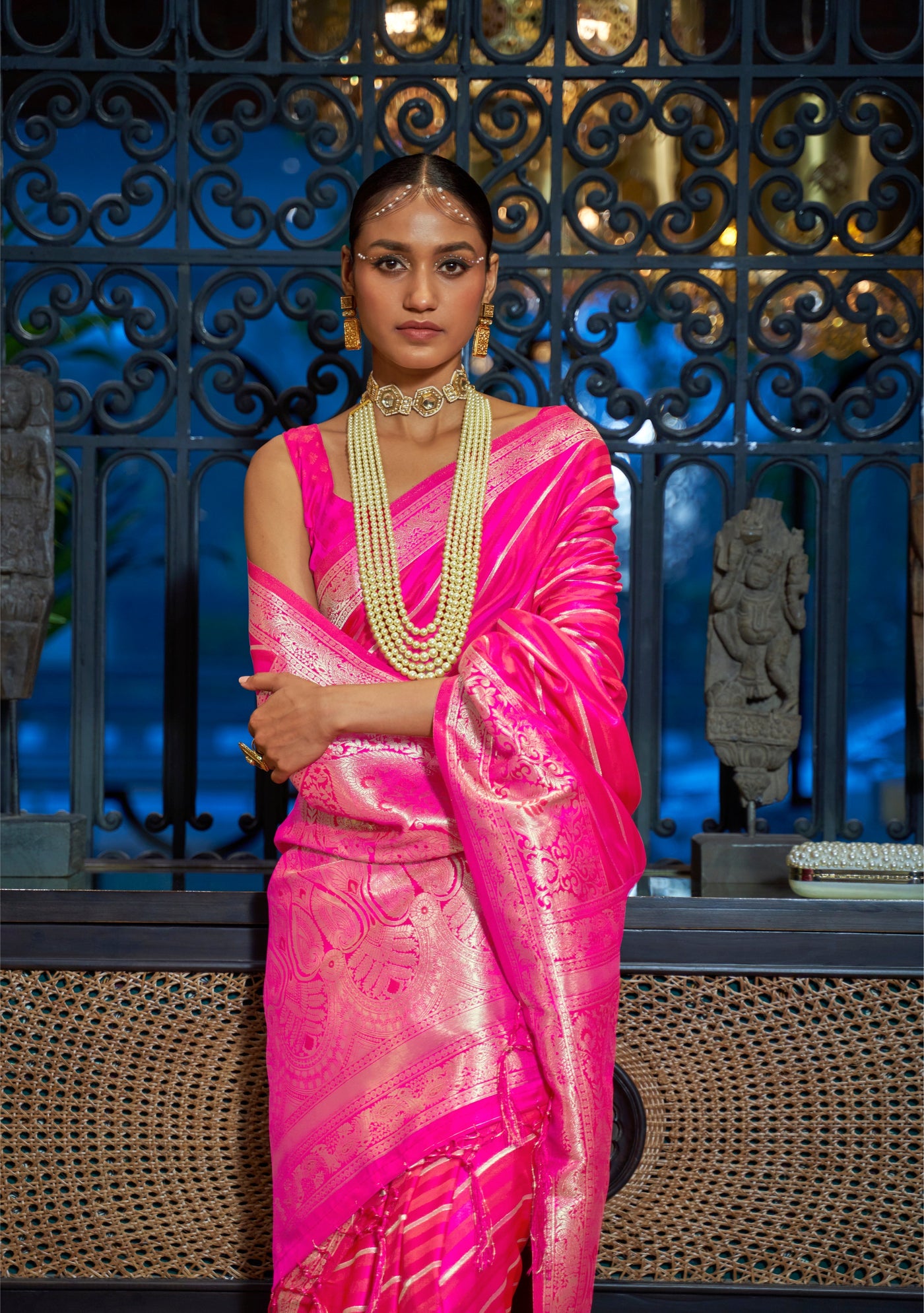 This Rani Pink–Gold Satin Silk saree features exquisite zari weave, designed for weddings, festive events, and cultural celebrations. Ideal for graceful draping and traditional styling. SKU 287001. This Rani Pink–Gold Satin Silk saree features exquisite zari weave, designed for weddings, festive events, and cultural celebrations. Ideal for graceful draping and traditional styling. SKU 287001.
