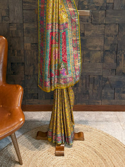 Colorful traditional garment on a wooden stand against a textured wall.