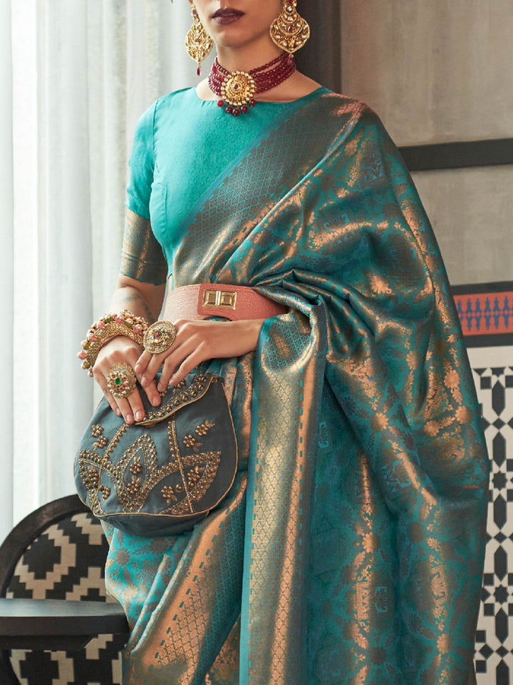 Royal kanjivaram silk saree in Teal Blue–Antique Gold with traditional motifs and contrast blouse. Teal Blue–Antique Gold wedding kanjivaram silk with soft zari sheen, heritage vibe, and jacquard elegance.