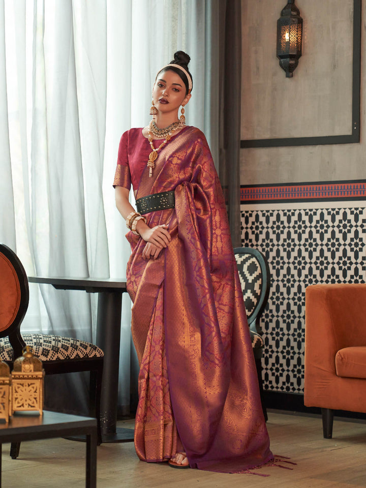 Maroon–Copper kanjivaram silk saree with traditional zari motifs and bridal styling for grand events. Two-tone wedding saree in Maroon–Copper with jacquard pallu and festive bridal drape.
