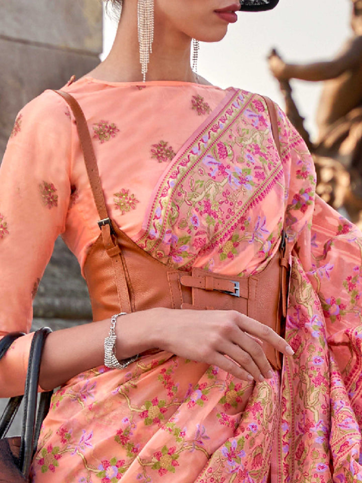 Blush Peach organza parsi silk saree with intricate multicolor thread floral embroidery and handloom craftsmanship, ideal for sangeet and styled perfectly for sister of the bride elegance and fashion-forward flair. This image captures the zoomed texture view illustrating fabric weave and print clarity, ideal for visualizing festive elegance, designer appeal, and modern styling inspiration. Perfect for online shoppers seeking detailed previews before purchase, enhancing saree visual merchandising and SEO-ric