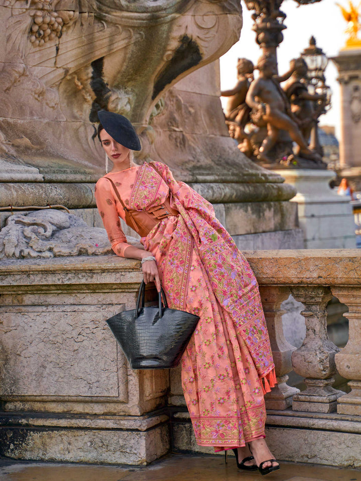 Blush Peach organza parsi silk saree with intricate multicolor thread floral embroidery and handloom craftsmanship, ideal for sangeet and styled perfectly for sister of the bride elegance and fashion-forward flair. This image captures the model styling perspective with complete saree ensemble displayed, ideal for visualizing festive elegance, designer appeal, and modern styling inspiration. Perfect for online shoppers seeking detailed previews before purchase, enhancing saree visual merchandising and SEO-ri