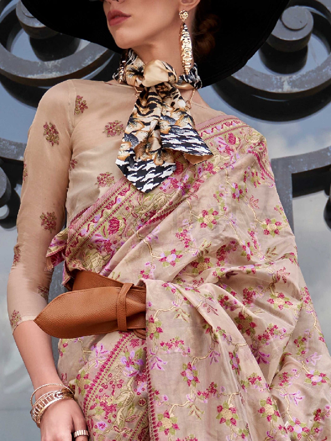 Champagne Beige organza parsi silk saree with intricate multicolor thread floral embroidery and handloom craftsmanship, ideal for wedding and styled perfectly for reception glam elegance and fashion-forward flair. This image captures the zoomed texture view illustrating fabric weave and print clarity, ideal for visualizing festive elegance, designer appeal, and modern styling inspiration. Perfect for online shoppers seeking detailed previews before purchase, enhancing saree visual merchandising and SEO-rich