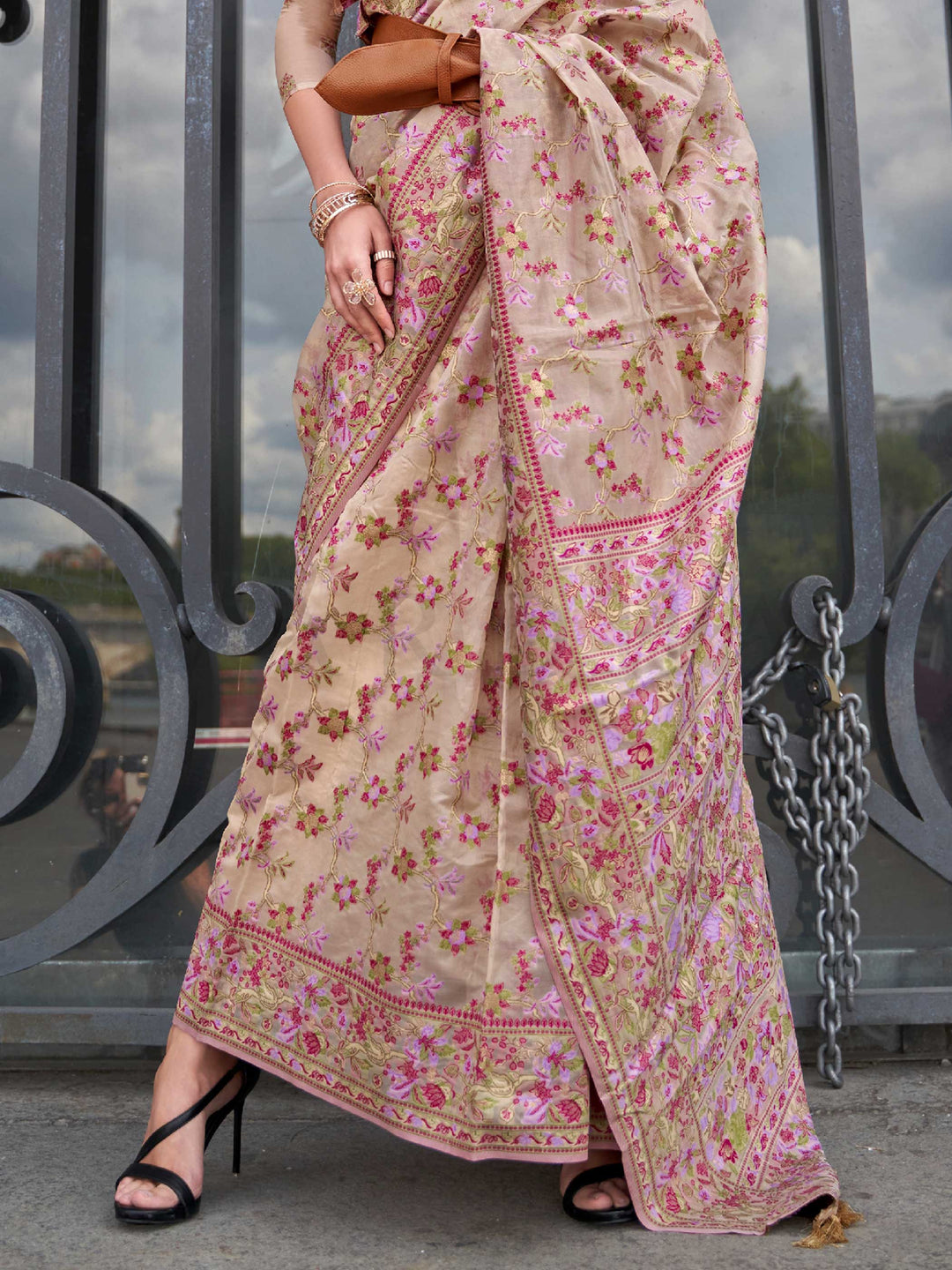 Champagne Beige organza parsi silk saree with intricate multicolor thread floral embroidery and handloom craftsmanship, ideal for wedding and styled perfectly for reception glam elegance and fashion-forward flair. This image captures the back drape focus revealing pallu finesse and motif richness, ideal for visualizing festive elegance, designer appeal, and modern styling inspiration. Perfect for online shoppers seeking detailed previews before purchase, enhancing saree visual merchandising and SEO-rich pro
