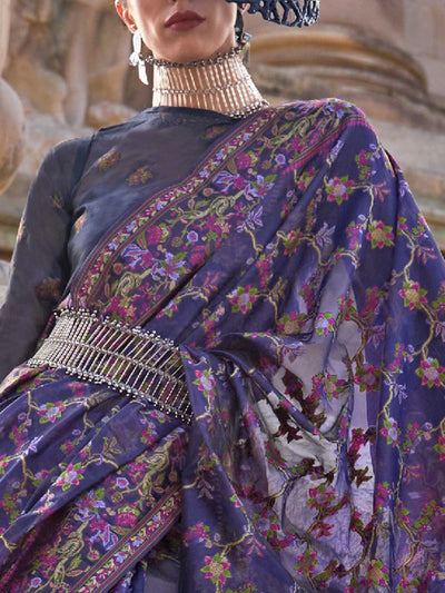 Royal Violet organza parsi silk saree with intricate multicolor thread floral embroidery and handloom craftsmanship, ideal for bollywood and styled perfectly for ramp walk look elegance and fashion-forward flair. This image captures the zoomed texture view illustrating fabric weave and print clarity, ideal for visualizing festive elegance, designer appeal, and modern styling inspiration. Perfect for online shoppers seeking detailed previews before purchase, enhancing saree visual merchandising and SEO-rich 