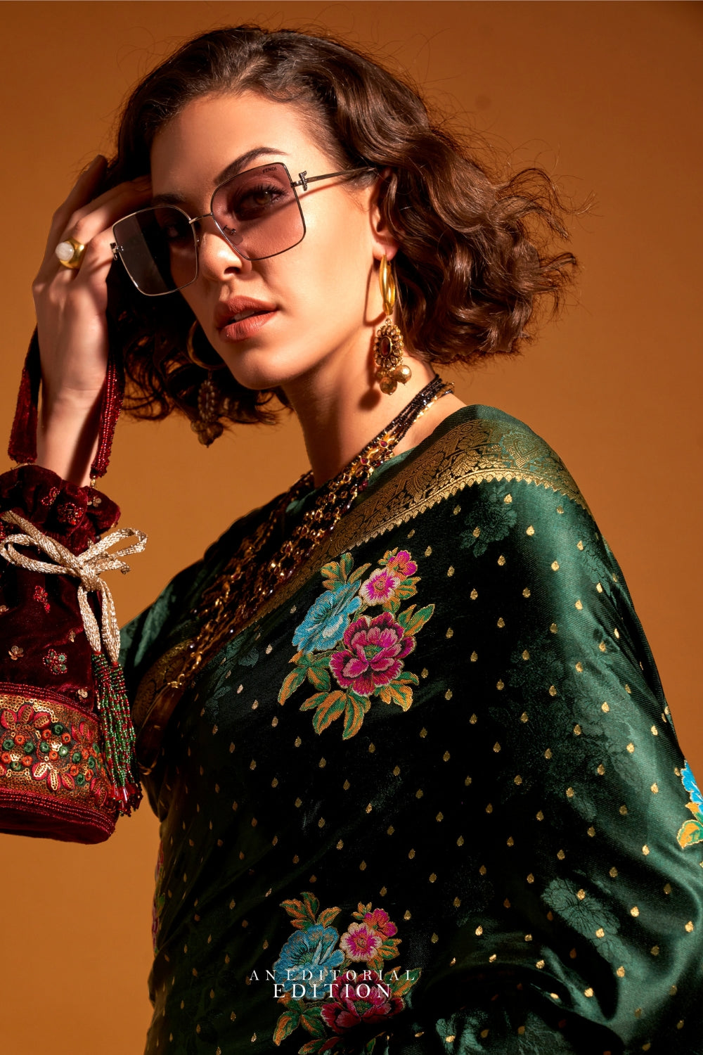Bottle Green pure satin silk saree with multicolour floral handloom weaving and rich zari border. Styled for sangeet and perfect for evening bride entry, blending regal silk elegance with festive florals. This image captures the back drape focus revealing pallu finesse and motif richness, ideal for visualizing festive elegance, designer appeal, and modern styling inspiration. Perfect for online shoppers seeking detailed previews before purchase, enhancing saree visual merchandising and SEO-rich product disp