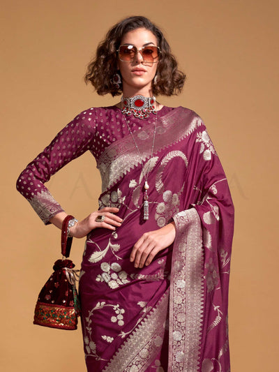 The saree is woven from high-grade pure georgette with intricate zari embroidery across the body in traditional floral motifs